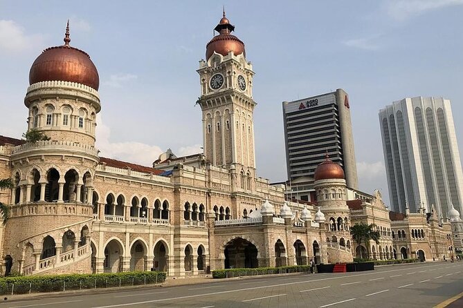 Kuala Lumpur City & Batu Caves Temple Private Tour - Batu Caves and the golden Murugan statue